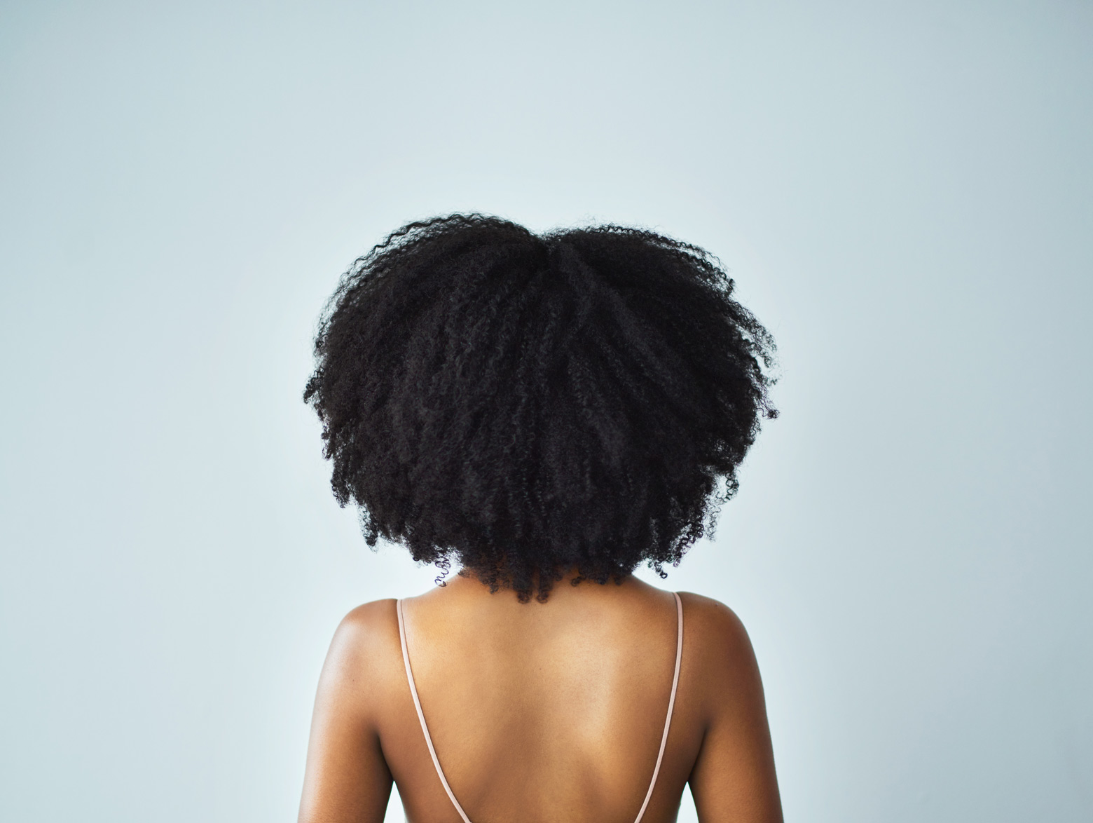 woman with natural hair back turned